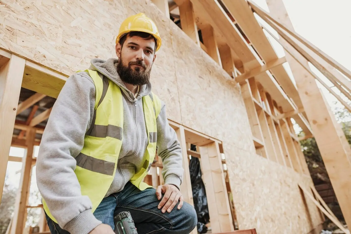 A carpenter worker seen from a low angle.